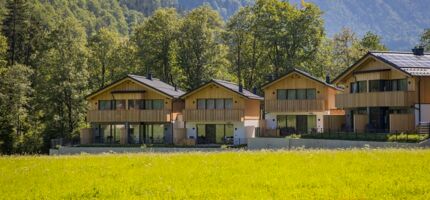 Exterior view of four luxury chalets in the Austrian Salzkammergut region