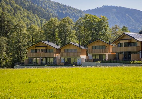 Exterior view of four luxury chalets in the Austrian Salzkammergut region