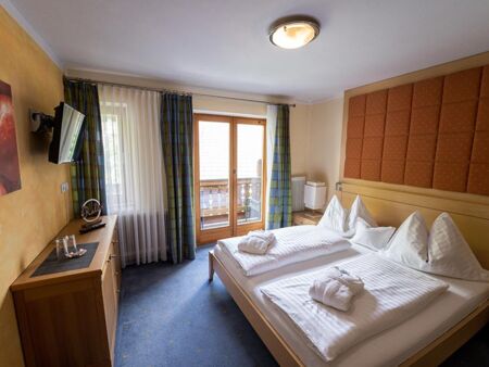 The homely furnishings of the sleeping area with access to the balcony