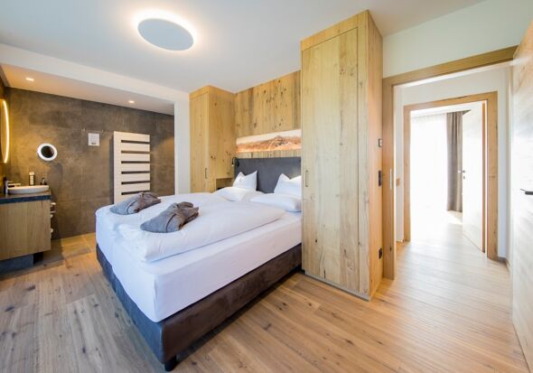 The modern bedroom in the chalet