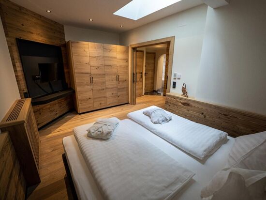 Double bed with huge flat screen TV