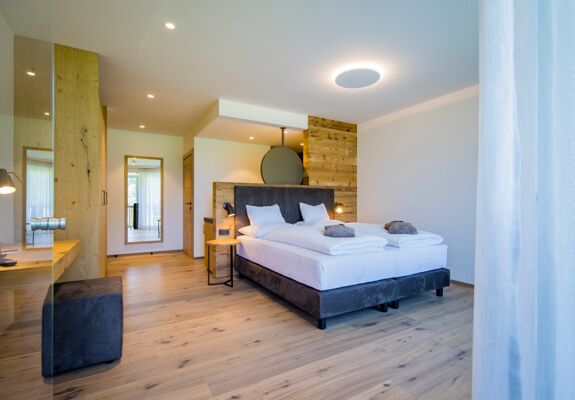 View from the terrace entrance to the double bed in the luxury chalet at Das Hintersee in Salzkammergut in Austria