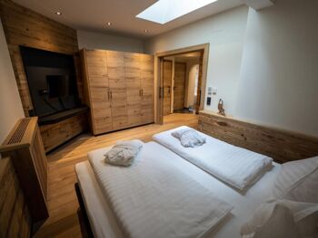 Double bed with huge flat screen TV