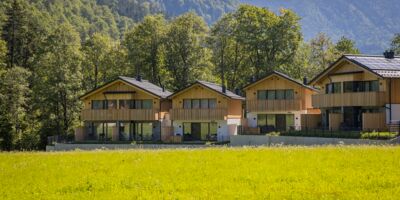 Exterior view of four luxury chalets in the Austrian Salzkammergut region