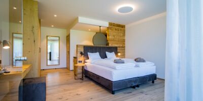 View from the terrace entrance to the double bed in the luxury chalet at Das Hintersee in Salzkammergut in Austria