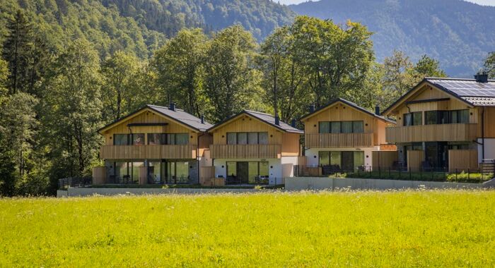 Exterior view of four luxury chalets in the Austrian Salzkammergut region