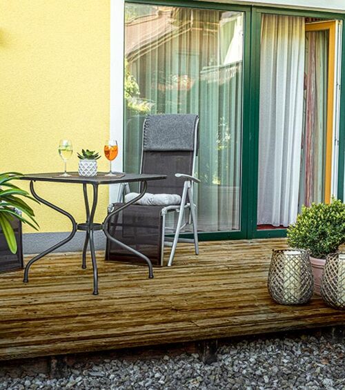 The modern wooden terrace of the Hotel Room Feichtenstein