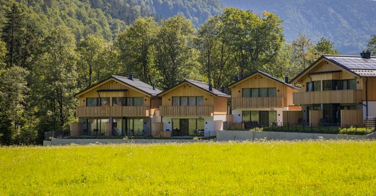 Exterior view of four luxury chalets in the Austrian Salzkammergut region