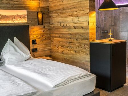 Elegant wood panelling in the sleeping area of the Anzenberg Appartement