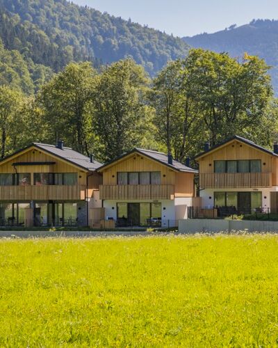 Exterior view of four luxury chalets in the Austrian Salzkammergut region