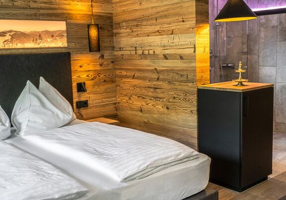 Elegant wood panelling in the sleeping area of the Anzenberg Appartement