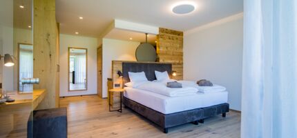 View from the terrace entrance to the double bed in the luxury chalet at Das Hintersee in Salzkammergut in Austria