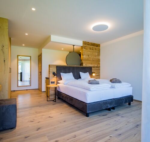 View from the terrace entrance to the double bed in the luxury chalet at Das Hintersee in Salzkammergut in Austria