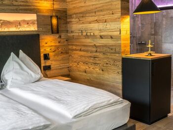 Elegant wood panelling in the sleeping area of the Anzenberg Appartement