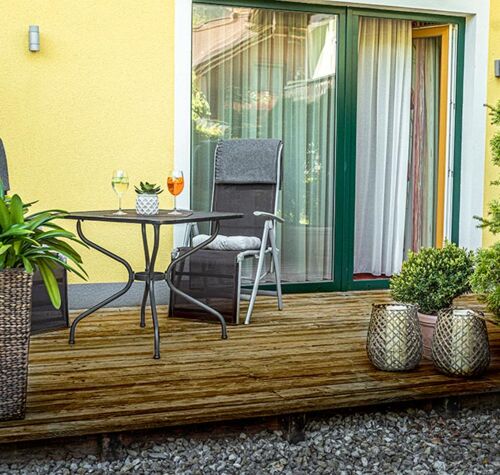 The modern wooden terrace of the Hotel Room Feichtenstein